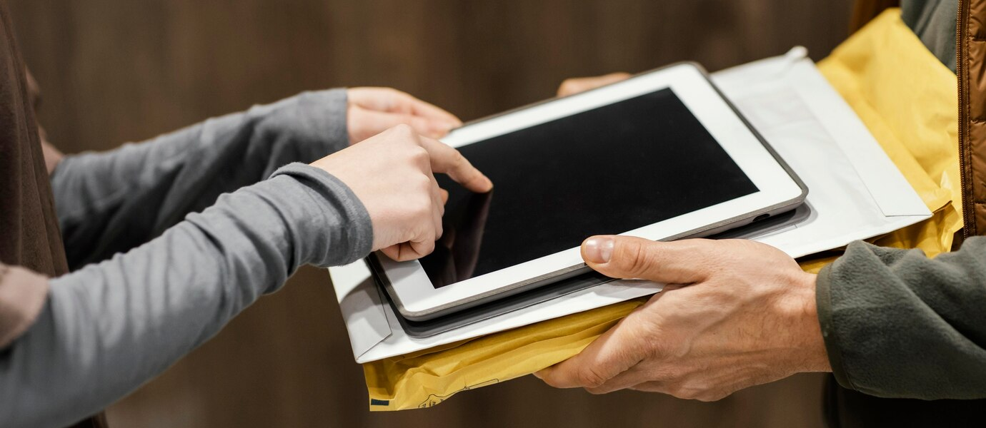 Guide showing the file transfer process from PC to iPad using USB cable