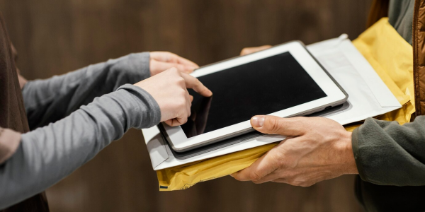 Guide showing the file transfer process from PC to iPad using USB cable